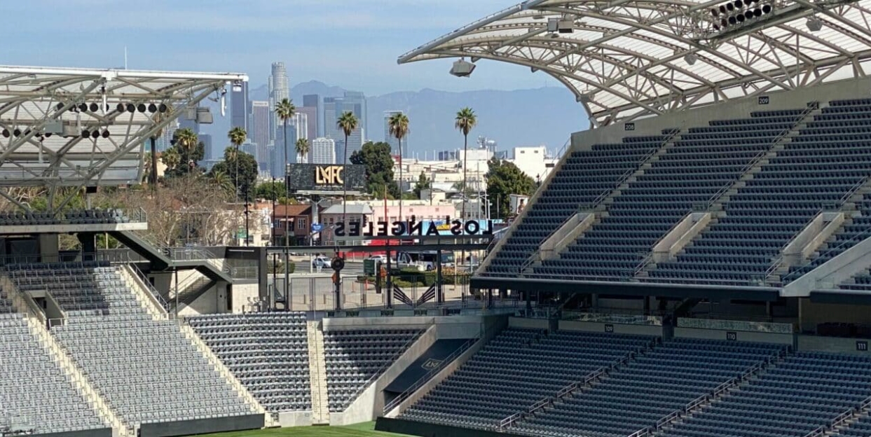 Part of the LAFC Stadium over looking Downtown LA Skyline.